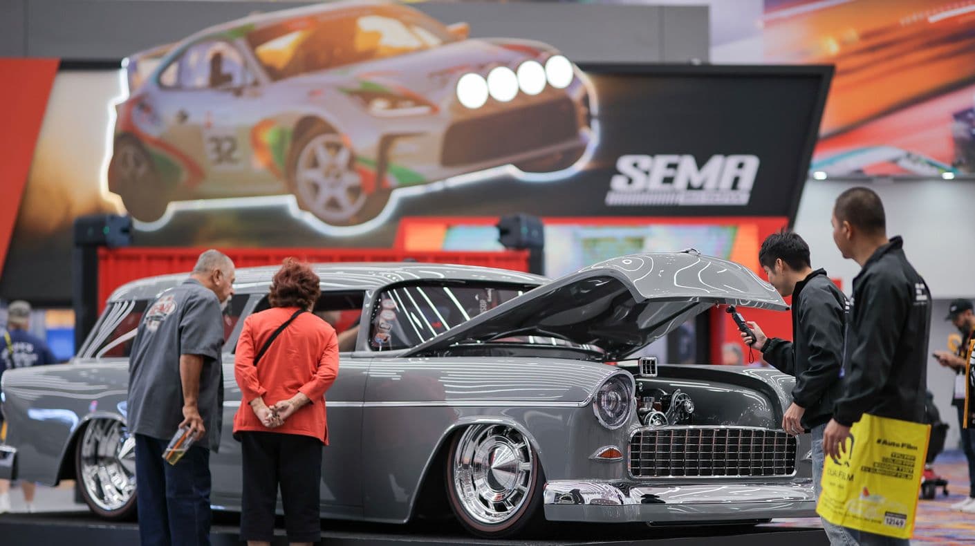 SEMA Show vehicle display and attendees at the 2025 SEMA Show