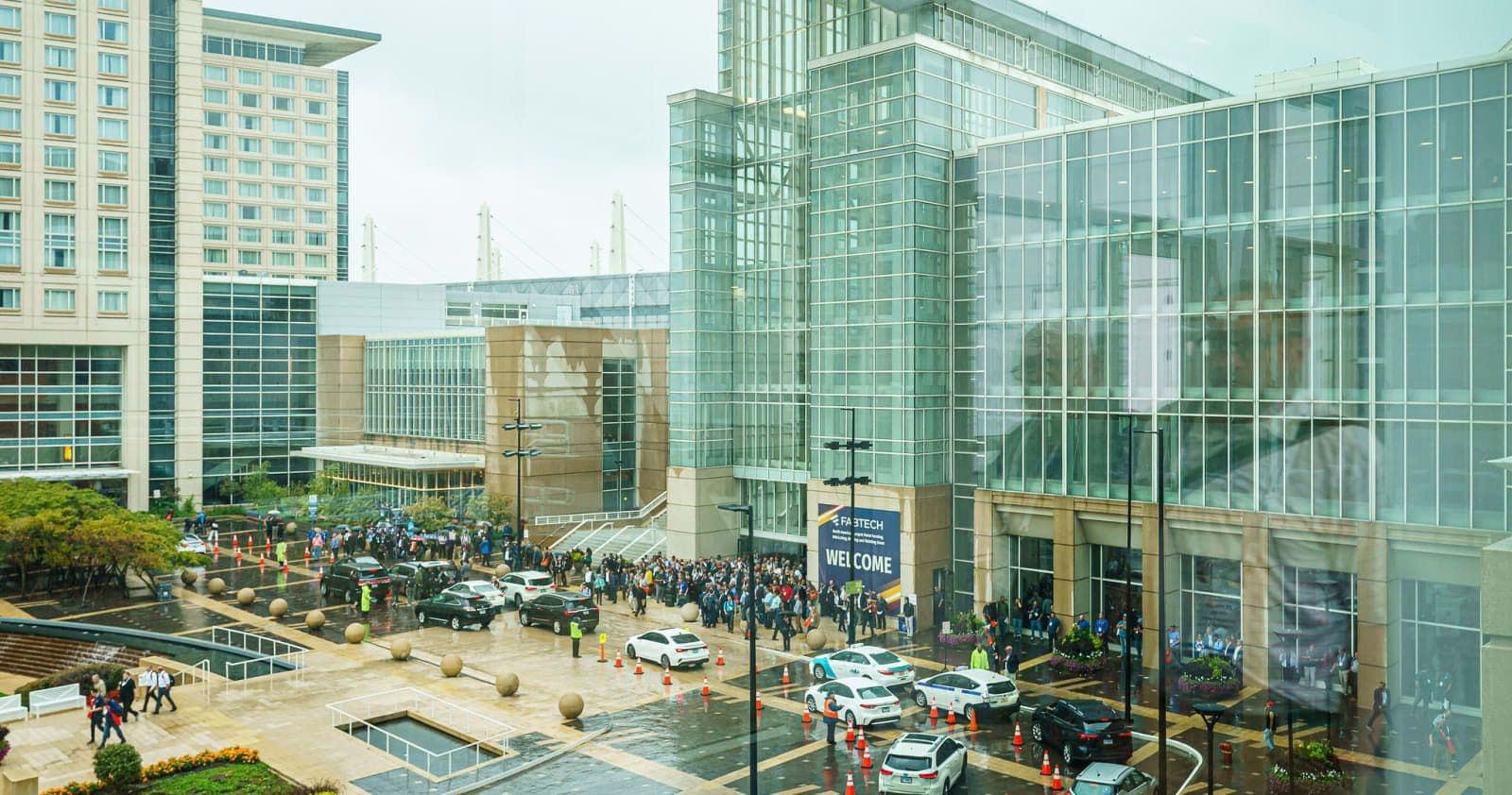 Attendees queuing beside FABTECH 2023 signage at the Chicago venue
