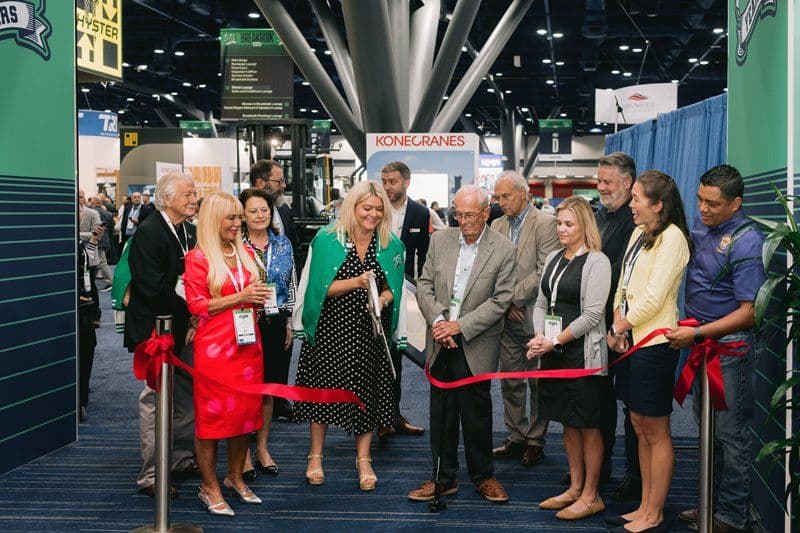 Ribbon-cutting group on the Breakbulk Americas exhibition floor in 2025