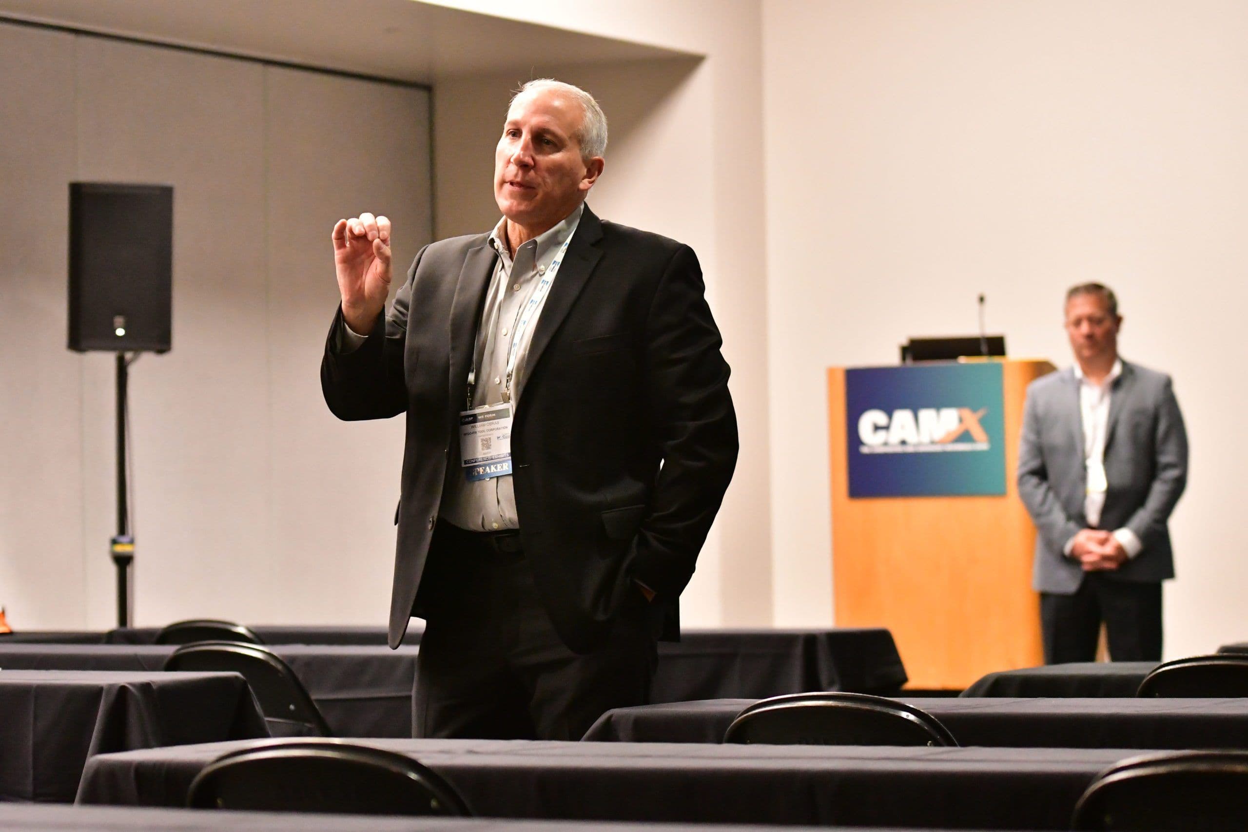 Speaker presents to attendees at a prior CAMX conference session