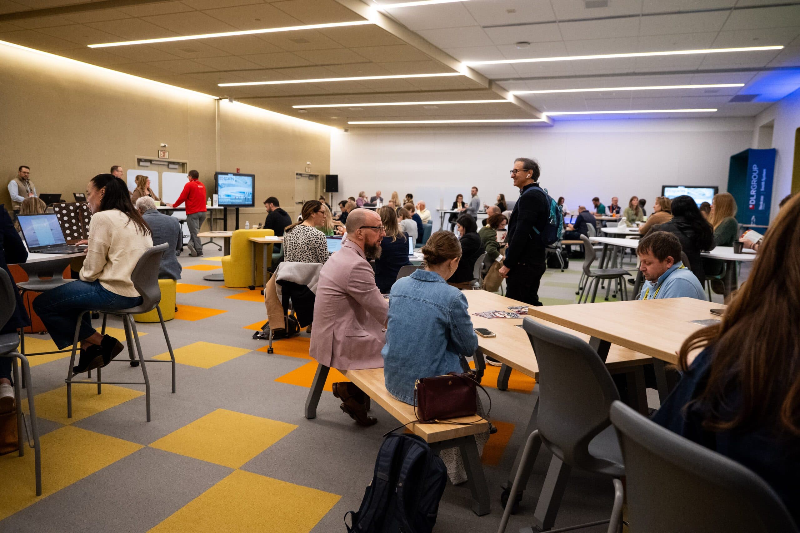 Participants discussing learning spaces in a furnished EDspaces room