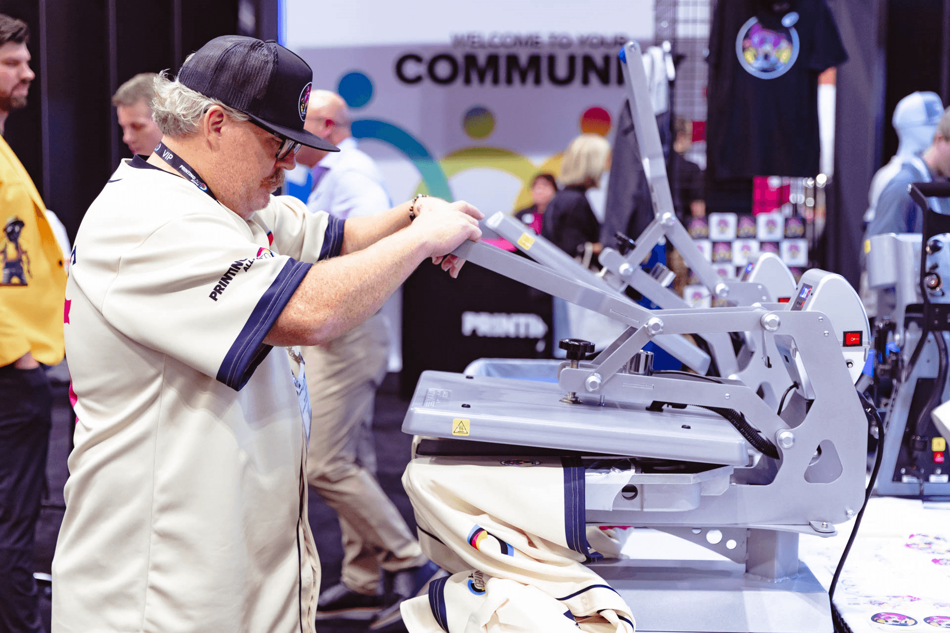PRINTING United Expo visitor watching a live equipment demonstration