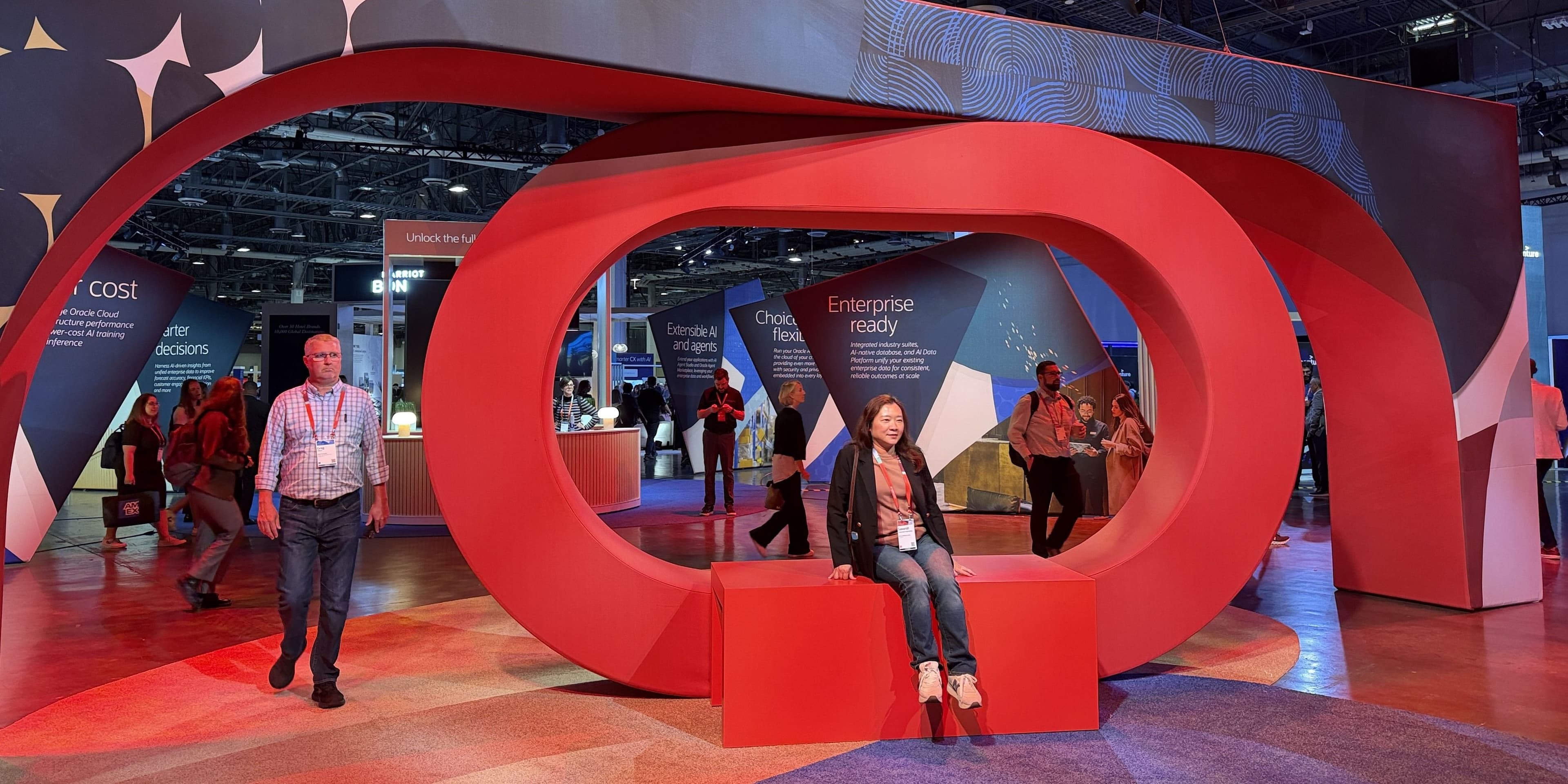 Attendees at a red Oracle AI World Hub installation