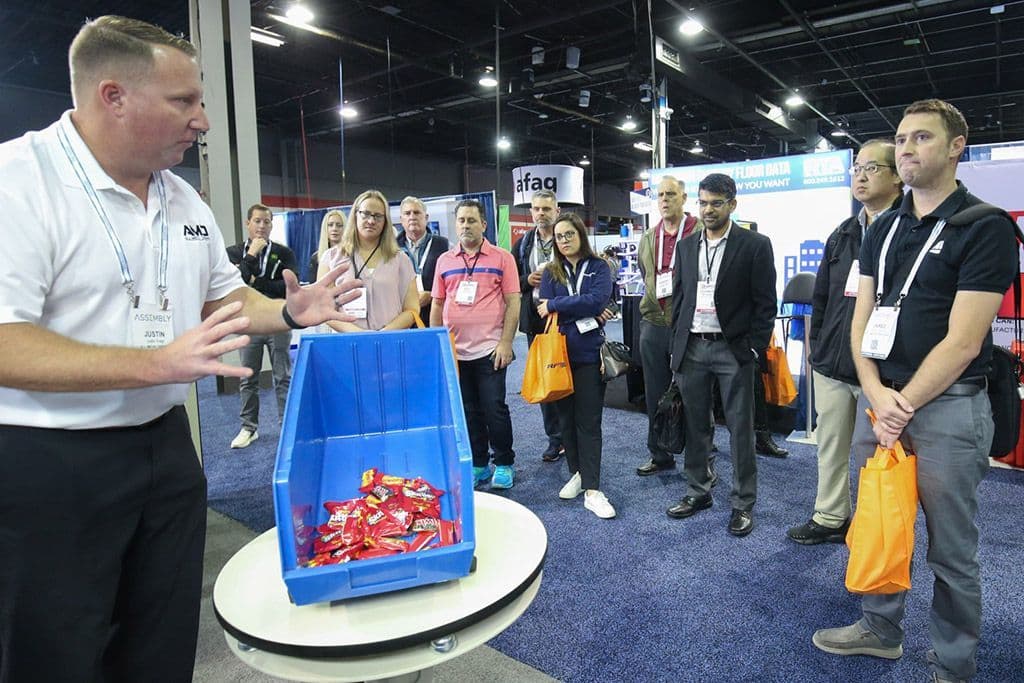 A presenter leading an equipment demonstration for a guided tour in 2023