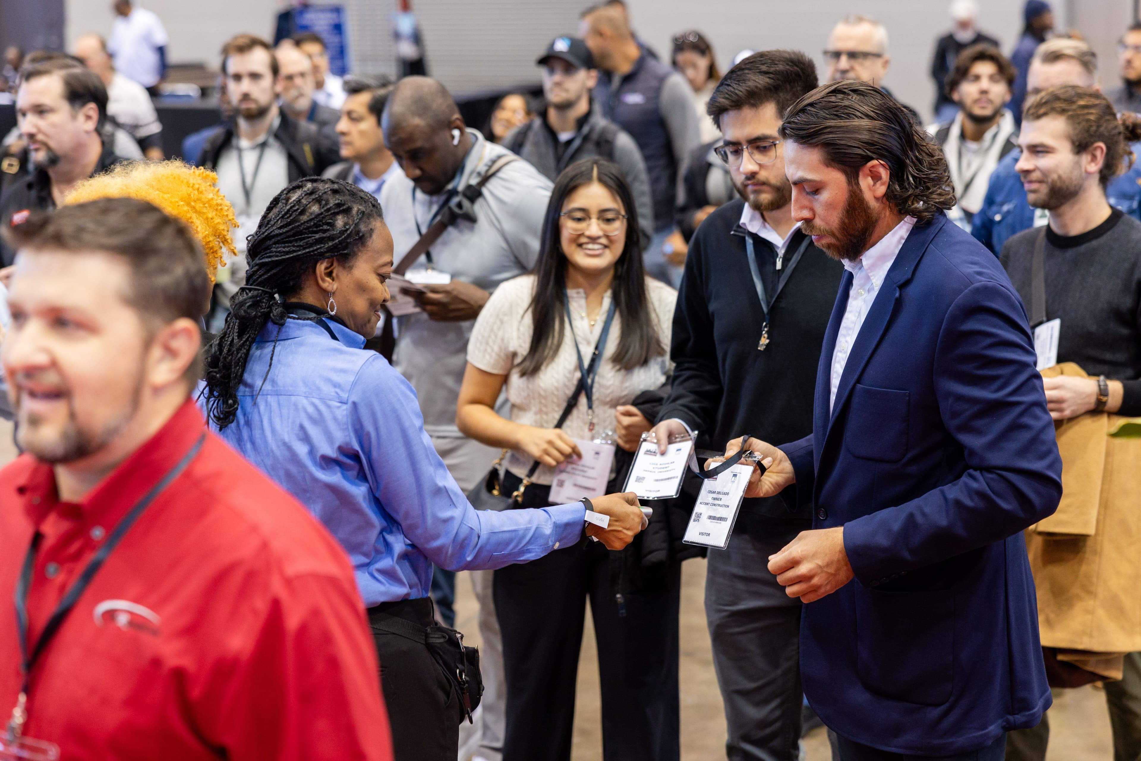 Attendees speaking on the Chicago Build 2025 floor