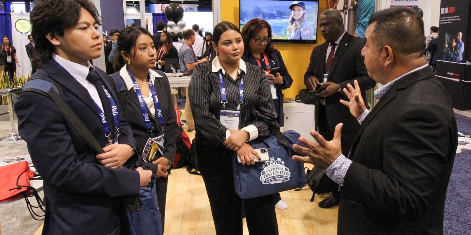 Engineering students speak with a recruiter at the 2024 SHPE convention