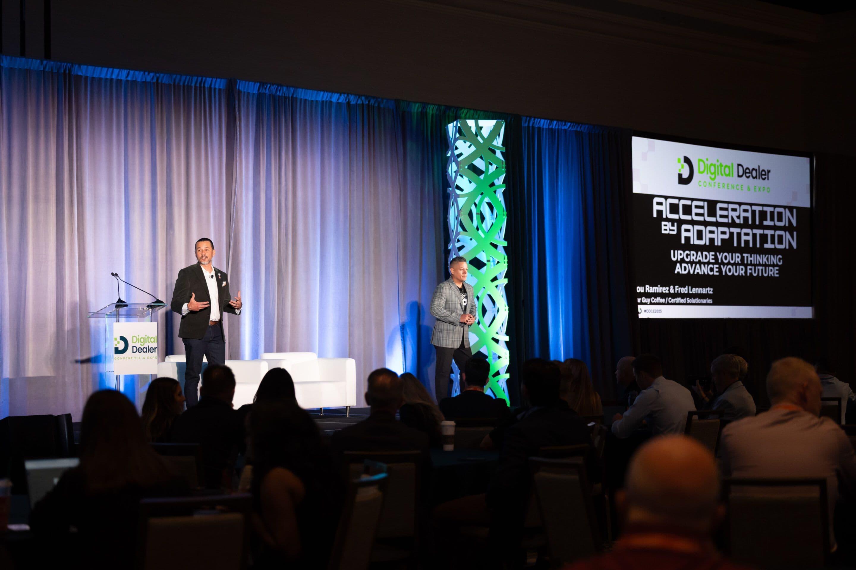 Speaker presenting on the Digital Dealer Conference and Expo 2025 keynote stage